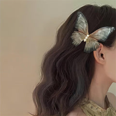 Fermaglio per capelli a farfalla con perla e rete trasparente