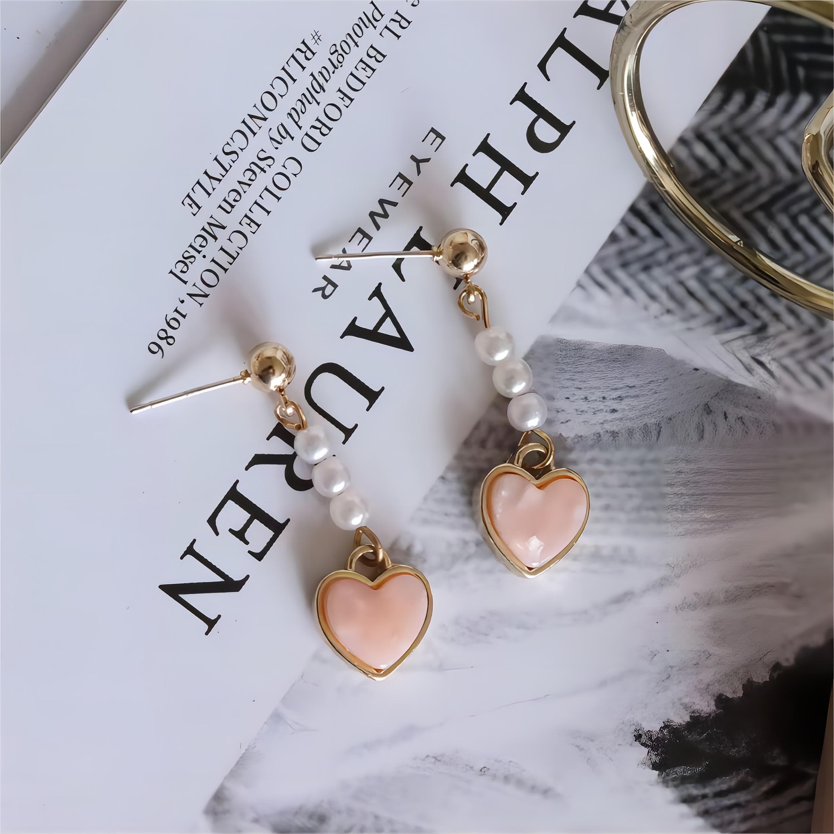 Eleganti orecchini pendenti a forma di cuore con perle