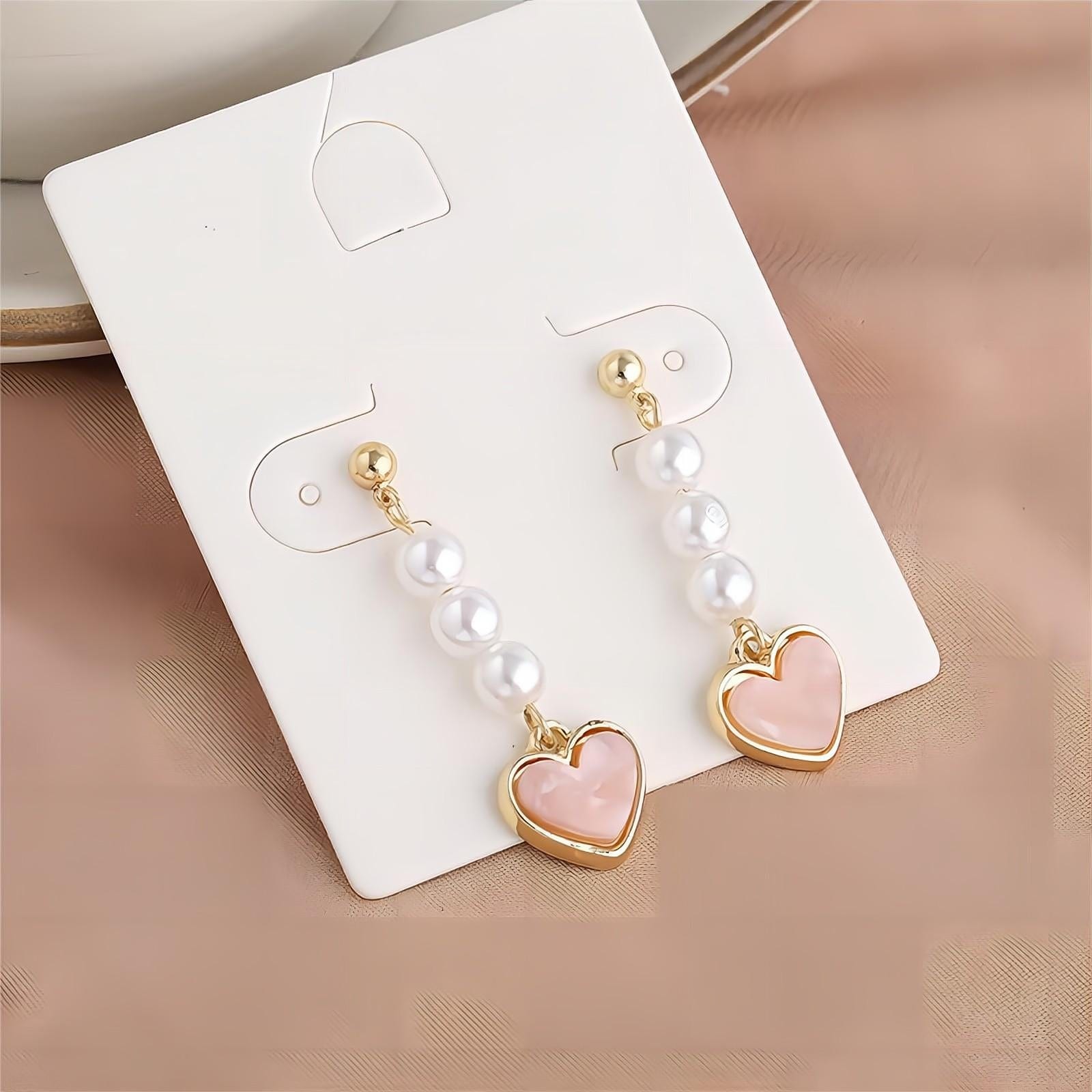 Eleganti orecchini pendenti a forma di cuore con perle
