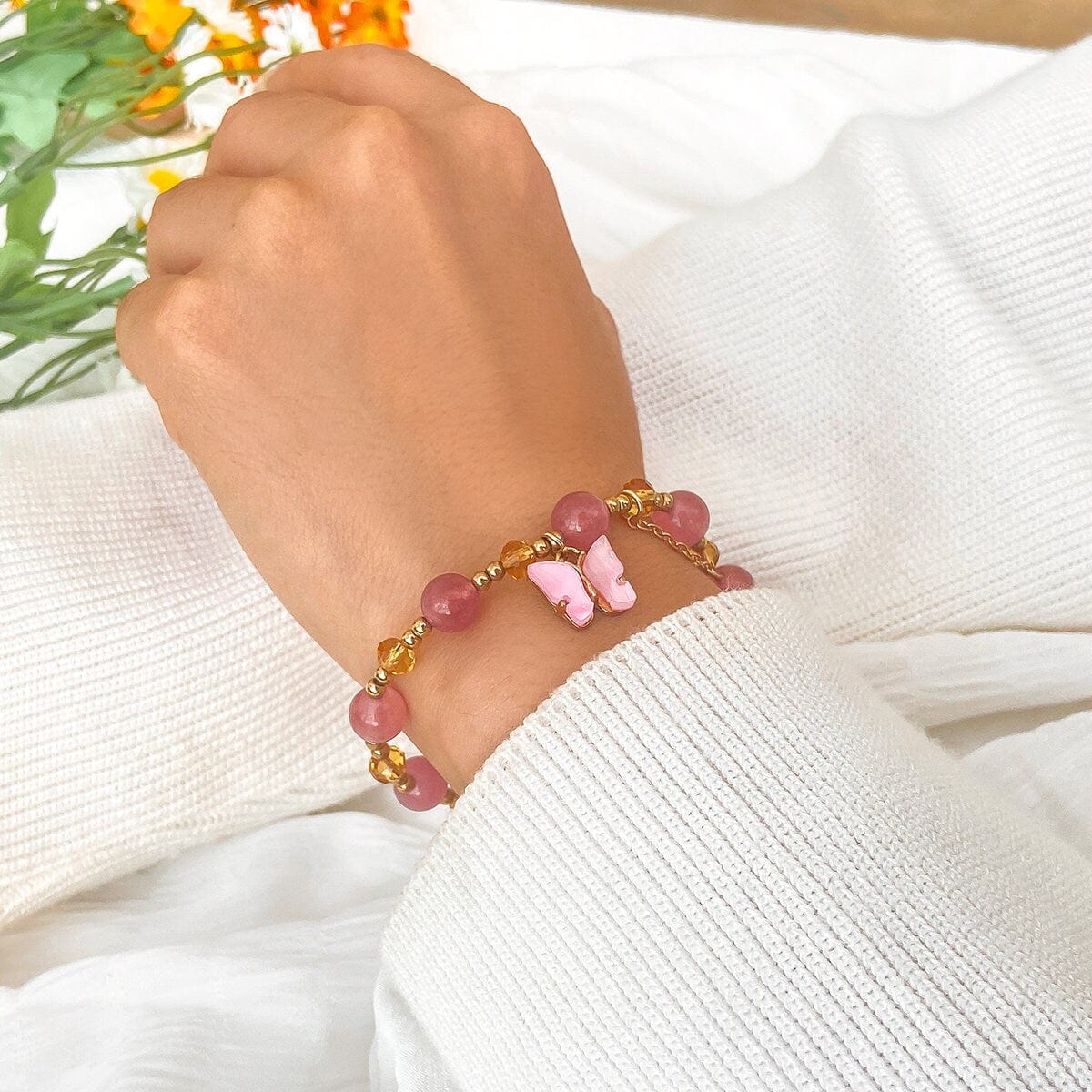 Bracciale con catena a sfere di cristallo naturale con ciondolo a farfalla rosa chic