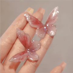 Eleganti orecchini pendenti a forma di farfalla rosa
