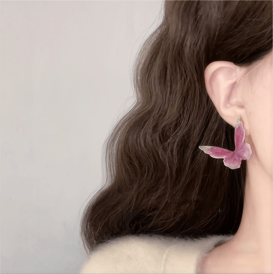 Eleganti orecchini pendenti a forma di farfalla rosa